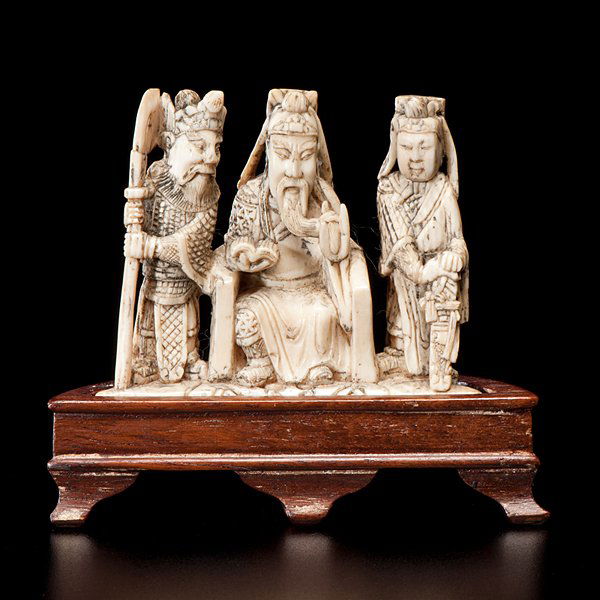 Chinese Carved Ivory Emperor with Attendants : Chinese, 19th century. A small figural group, carved to reveal an emperor and two warrior attendants, on stand; ht. 3 in.