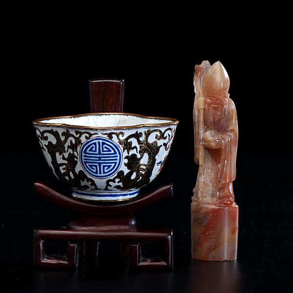 Chinese Cup and Seal : Chinese, a Canton enamel cup on rosewood stand, as well as soapstone seal; ht. of seal 3 in. Ex Collection of Dr. Herman Charles and Jannette Groman of Hammond, IN. Dr. Charles (1882-1954) was a