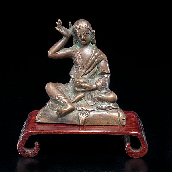 Nepalese Bronze of Tara : Nepal, 19th century. A bronze of seated Tara, on stand with with accompanying export documents and seals; ht. of bronze 3.25 in.