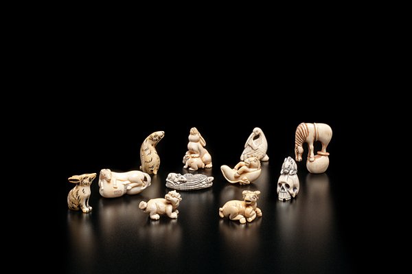 Collection of Japanese Carved Animal Netsukes : Japanese, early 20th century. A group of eleven (11) carved and inked ivory netsuke, six with identifying marks; ht. of tallest 2 in.