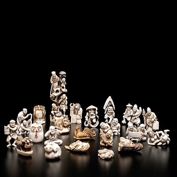 Large Collection of Japanese Ivory Netsuke and Carvins : A collection of 21 Japanese ivory carvings, including 20 netsuke and one small mountain carving; tallest 5.25 in.