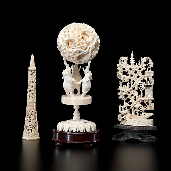 Chinese Ivory Carvings : Chinese, 20th century. Includes a Chinese ivory puzzle ball on stand, a small carved ivory tower, and reticulated plaque; tallest ht. 4 in.