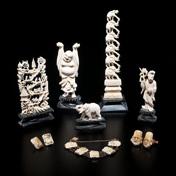 Asian Ivory Carvings, Cufflinks and Bracelet : Asia, 20th century. 11 carvings, including several Chinese carvings, with tower and Buddha, also two pairs of ivory inlaid cufflinks and a bracelet, each with faces carved; ht. of tallest 4.25 in.