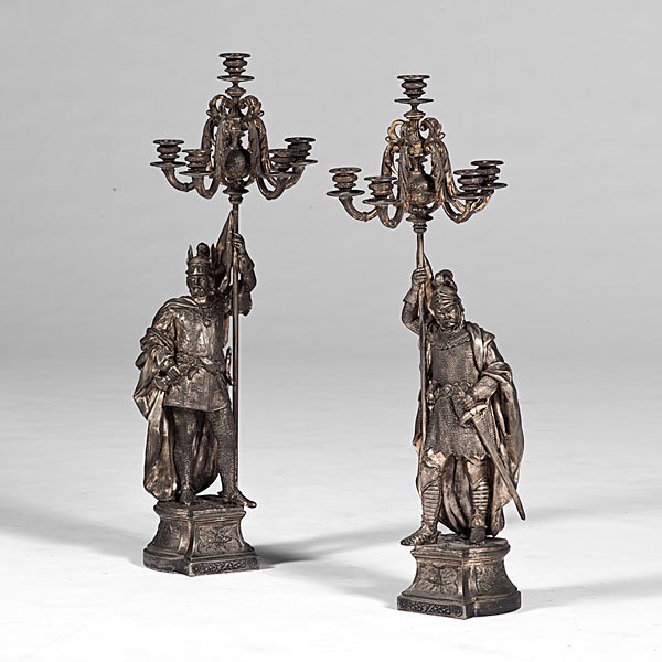 Spelter Knight Candelabras : Spelter Knight Candelabras Continental (probably German), 19th century. A pair of spelter knights clad in armor, each holding up a five-arm candelabra and perched atop stands decorated with Classica