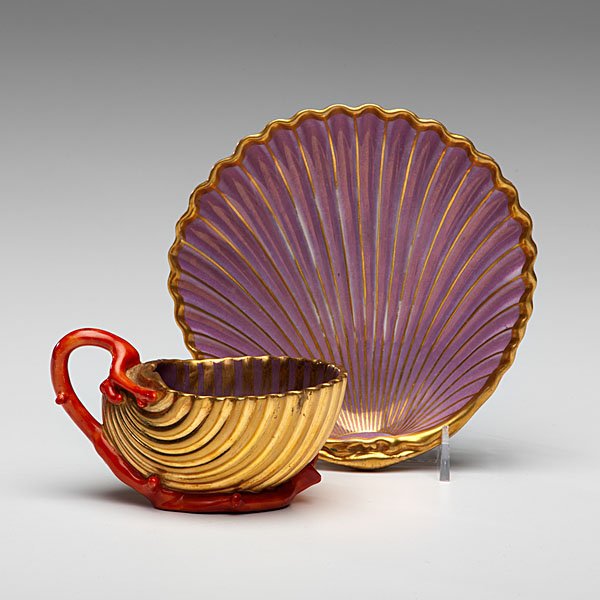 Dagoty Paris Porcelain Cup and Saucer : Dagoty Paris Porcelain Cup and Saucer French, ca 1800-1810. A P.L. Dagoty Paris porcelain gilded shell-form cup and saucer in purple, the cup with a coral shaped handle and base and painted floral i