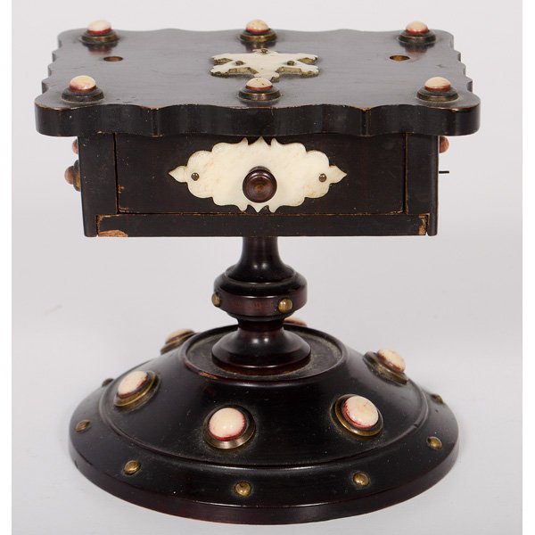 Anglo-Indian Sewing Stand : Anglo-Indian Sewing Stand Anglo-Indian, 19th century. A sewing stand of ebonized wood, having a scalloped-edge top above a single-drawer cabinet, all rising on a round pedestal base with a turned co