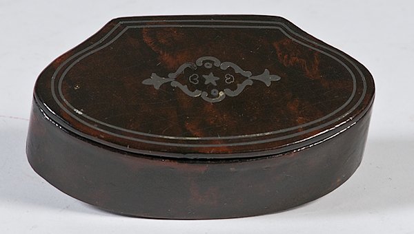 Faux Tortoise Box with Pewter Piqué Work : Faux Tortoise Box with Pewter Piqué Work Possibly English, ca 1860s, an oval box with flat back, hinged and with top inlaid with pewter stringing and a center medallion. The initials, "J. C." are s