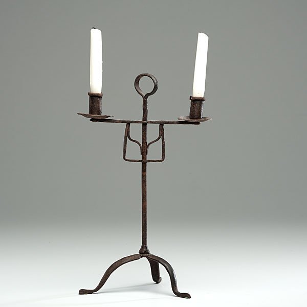 American Wrought Iron Candlestand : American Wrought Iron Candlestand American, 19th century. Wrought iron adjustable double armed candlestand rising on three cabriole legs with snake feet; ht. 15.5 in.