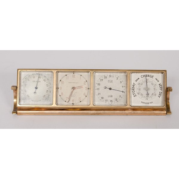 Tiffany & Co. Portable Clock with Barometer : Tiffany & Co. Portable Clock with Barometer American. A Tiffany & Co. portable desk clock that includes a thermometer, calendar and barometer on a swivel stand; lg. 6.5 in.