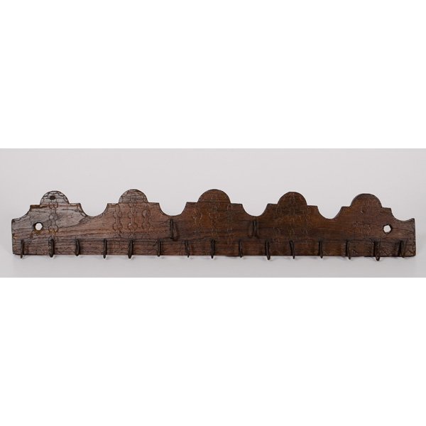 Carved Game Rack : Carved Game Rack American, 19th century. A wood game rack with carved and shaped board and iron hooks; lg. 34 in.