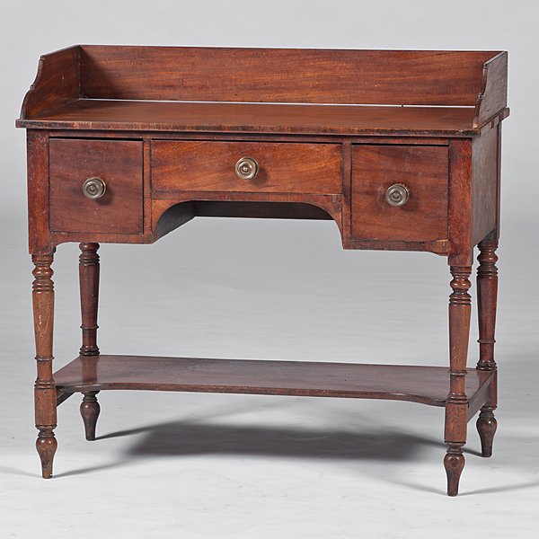 Small Sheraton Walnut Server : Small Sheraton Walnut Server 19th century. A three drawer mahogany veneer server with backsplash, having dovetail construction and rising on turned legs; ht. 35.5, wd. 39, dp. 19.5 in.