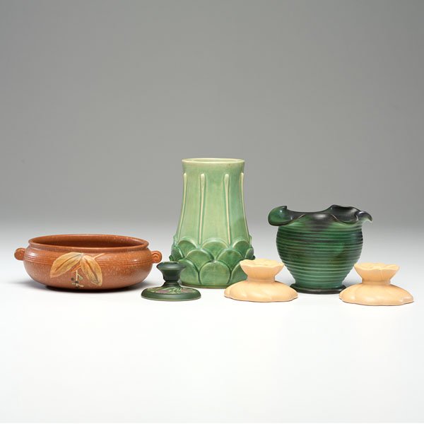 Weller Pottery Group : Weller Pottery Group Group of Seven Weller Pottery vessels; includes Pair of Candlesticks Ceramic; tallest vase: ht. 9, dia. 5.5 in. Patterns include:Manhattan vase, Fleron vase and Cornish vase