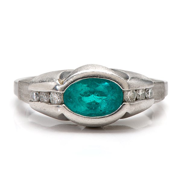 Ladies Platinum Ionesco Designs Tourmaline Ring : Ladies Platinum Ionesco Designs Tourmaline Ring Ladies platinum ring containing one 8mm x 6mm x 3.5mm intense blue/green Paraiba Tourmaline weighing approximately 1.0 carats bezel set in the cent