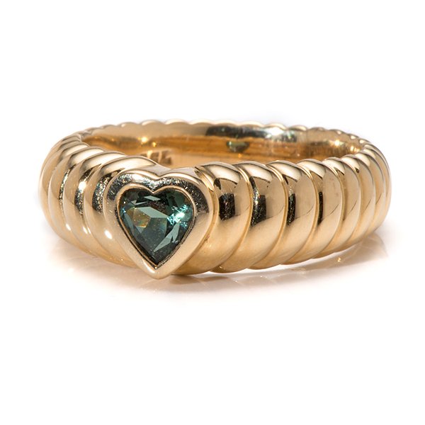 Tiffany & Co. 18 Karat Yellow Gold Friendship Ring with: Tiffany & Co. 18 Karat Yellow Gold Friendship Ring with Green Tourmaline Ladies Tiffany & Co. 18k yellow gold friendship ring containing one 5mm heart-shaped green tourmaline. Ribbed design with bez