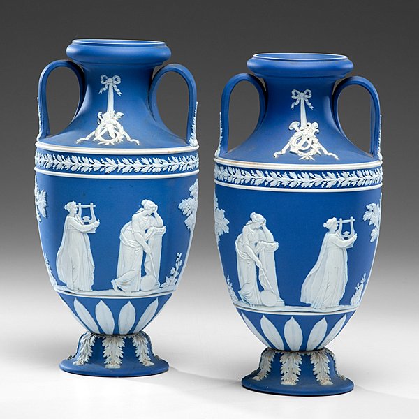 Wedgwood Jasperware Bolted Urns : Wedgwood Jasperware Bolted Urns English, early 20th century. A pair of Wedgwood jasperware urns with contrasting white paste sprigged decoration; ht. 11.5 in.