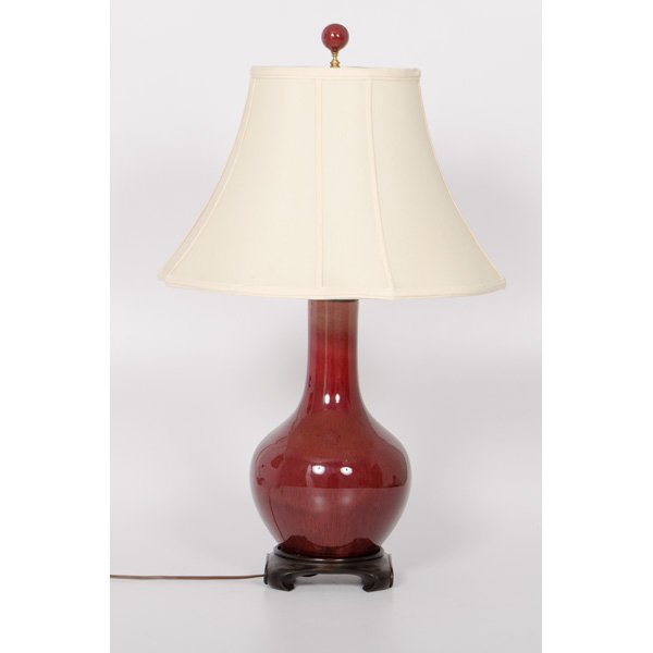 Chinese Sang de Boeuf Lamp : Chinese Sang de Boeuf Lamp Chinese. A sang de boeuf porcelain bottle vase, mounted as a lamp, electrified and with off-white shade; ht. 32 in.