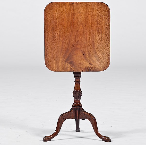 Georgian Tilt-Top Candlestand : Georgian Tilt-Top Candlestand English, 18th century. A Georgian tilt-top candlestand in mahogany, the top with rounded corners above a turned and carved standard and raised on carved cabriole legs e