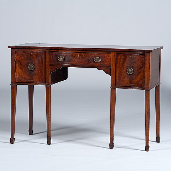 Hepplewhite Mahogany Sideboard : Hepplewhite Mahogany Sideboard English, 19th century. A Hepplewhite serpentine front sideboard in mahogany having a center drawer with string inlay, flanked by doors with matching inlay, rising on f