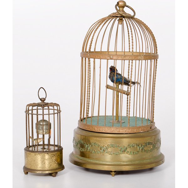 Mechanized Bird-in-a-Cage Pieces : Mechanized Bird-in-a-Cage Pieces Continental, early 20th century. Two bird automaton novelties; one, a French singing bid in a brass cage, and the other, a German caged bird time clock with rotating