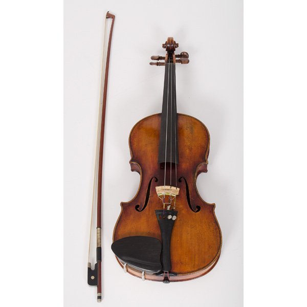 Violin with Josef Guarnerius Label : Violin with Josef Guarnerius Label Continental. A violin retaining an interior label reading Josef Guarnerius fecit / Cremouro Anno 1715 IHS, accompanied by a bow, case, and shoulder rest; lg. 23.5 