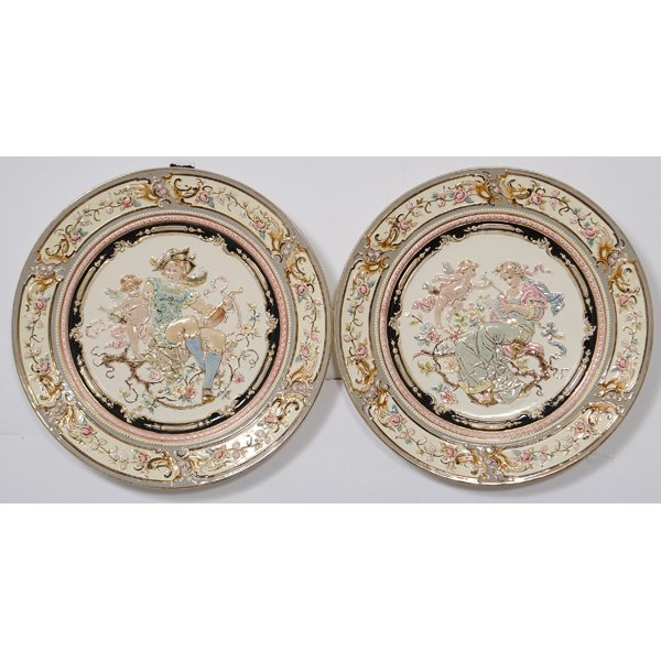 Austrian Porcelain Plates : Austrian Porcelain Plates Austrian, 20th century. A pair of painted porcelain plates, with scenes of a cherub and a troubadour as well as a cherub and a maiden in relief. Reverse marked Atelier J. Z