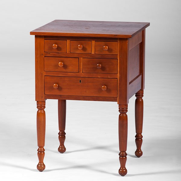 Work Table in Cherry : Work Table in Cherry American. A work table in cherry, with square top over six drawers, on turned legs; ht. 29, wd. 20.5, dp. 20.25 in.