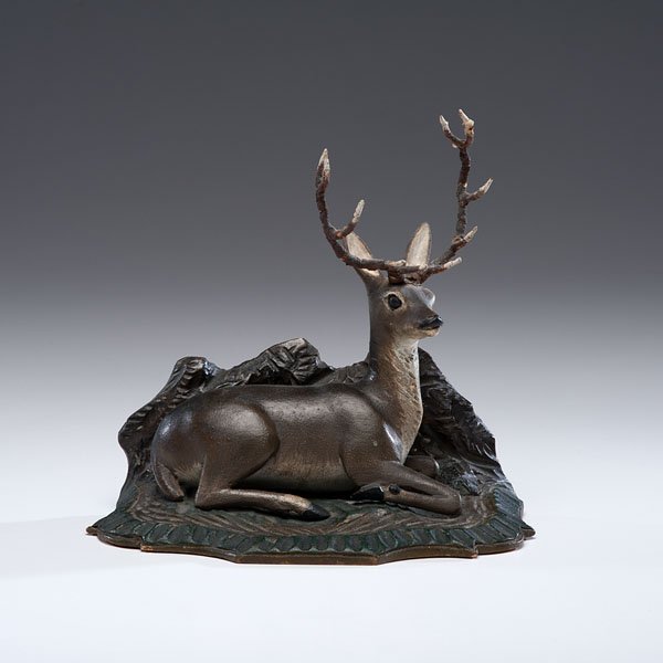 Carved and Painted Folk Art Deer : Carved and Painted Folk Art Deer American, 19th century. A carved and painted folk art deer with twig antlers and a carved and painted mantle stand, possibly used as a bookend; ht. 9, lg. 9.5 in.