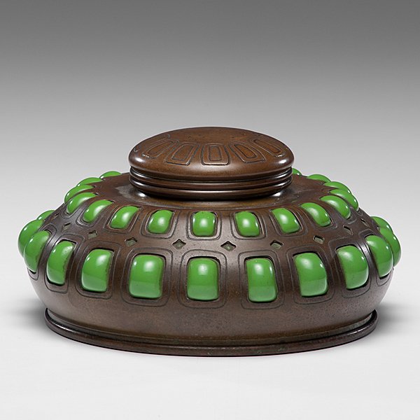 Tiffany Studios Bronze and Blown-Out Glass Inkwell : Tiffany Studios Bronze and Blown-Out Glass Inkwell American, ca 1900. A Tiffany Studios blown-out glass inkwell in the Art Nouveau style, having a round bronze frame punctuated by blown-out green gl