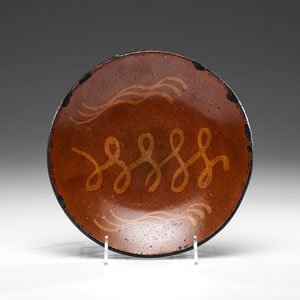 Pennsylvania Redware Plate : Pennsylvania Redware Plate Pennsylvania, 19th century. A redware plate with yellow slip decoration and coggled edge; dia. 11.25 in.