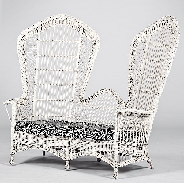 Wicker Lounge Suite : Wicker Lounge Suite American, 20th century. A white wicker suite of two chairs and a settee with covered cushion seats; settee ht. 68 in, larger chair ht. 68 in.
