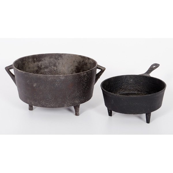Footed Cast Iron Skillet and Kettle : Footed Cast Iron Skillet and Kettle American, 19th century. A footed cast iron skillet and large kettle; kettle ht. 7.5, dia. 13.25 in.