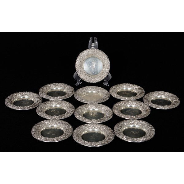 Sterling Repousse Coasters : Sterling Repousse Coasters American, 20th century. A set of twelve coasters with a repoussé border, all marked Sterling / 5992; dia. 3.75, silver wt. 15.94ozt (496g). Provenance: Property from