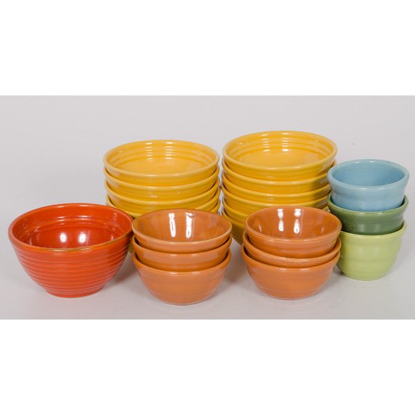 Large Lot of Bauer Pottery Bowls : Large Lot of Bauer Pottery Bowls American, 20th century. A lot of twenty-two Bauer pottery bowls, including twelve dinner bowls in yellow, six side bowls in light brown, three small bowls in forest
