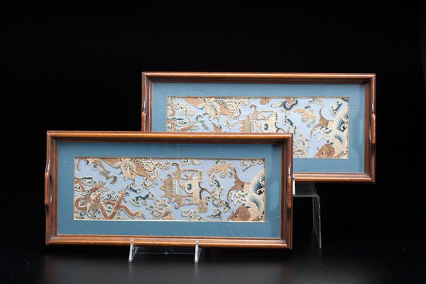 A Pair of "Forbidden Stitch" Chinese Altar Panels in: A Pair of "Forbidden Stitch" Chinese Altar Panels in Trays Chinese, late 19th century. A pair of "blind stitch" panels, converted to trays, each having dragon, phoenix and celestial decoration. Lg