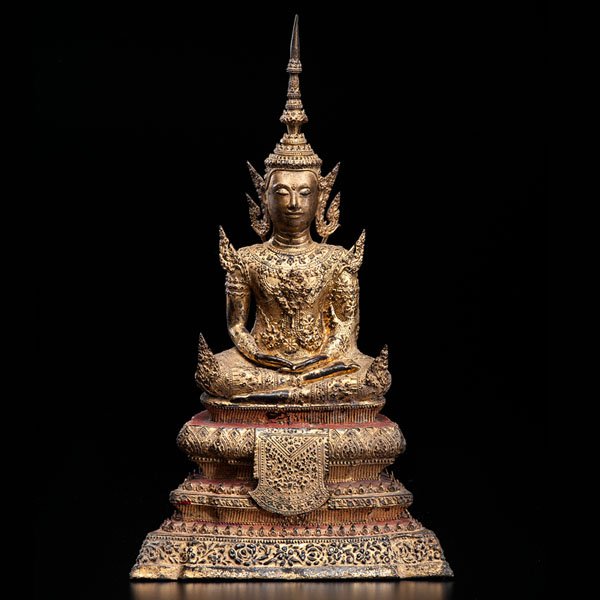 Thai Gilded Bronze Buddha : Thai Gilded Bronze Buddha Thai, 19th century. A gilded bronze sculpture representing a seated, crowned, and meditating Buddha on a throne. 5.5 x 10.25 x 18.25 in. Cowan’s is pleased to present a