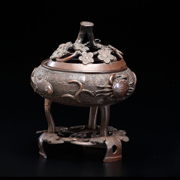 Incense Bowl : Incense Bowl Chinese, late Qing dynasty. A bronze incense bowl with three tall feet and stand. The bowl is decorated with fish, crab and crayfish motifs. The lid is decorated with a plum blossom pat