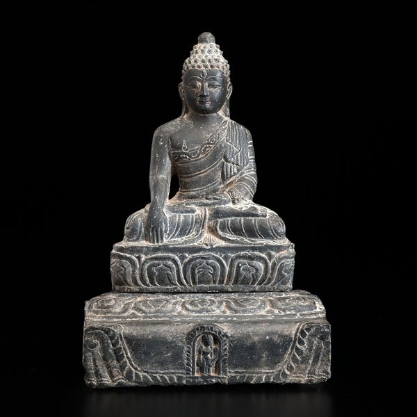 Black Stone Seated Buddha : Black Stone Seated Buddha Nepalese, 19th century. A black stone sculpture of a seated Buddha on a lotus throne. The Buddha is shown in Bhumisparsha mudra (earth-touching hand gesture). The piece com