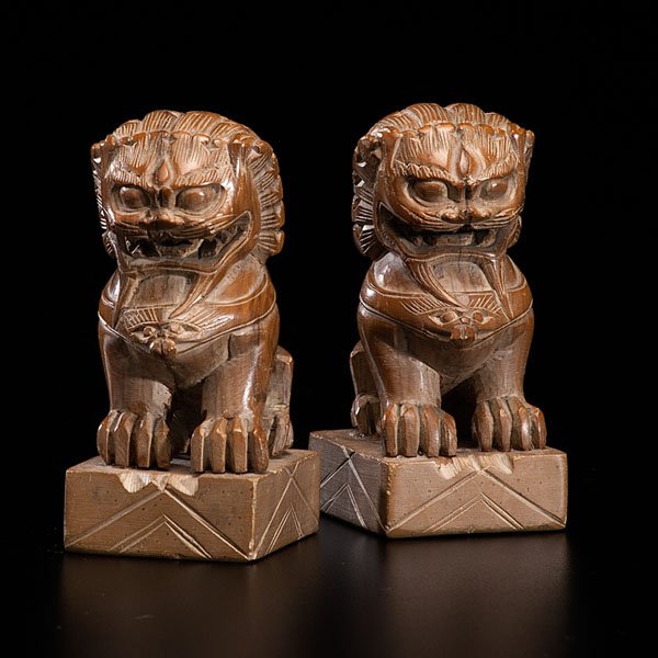 Pair of Foo Dogs : Pair of Foo Dogs Chinese, 20th century. Two Foo Dog figurines craved into soapstone. The "Foo Dog" is the Western appellation for the Chinese "Guarding Lion." 2 x 4.25 x 2.25 in. Provenance: Pro