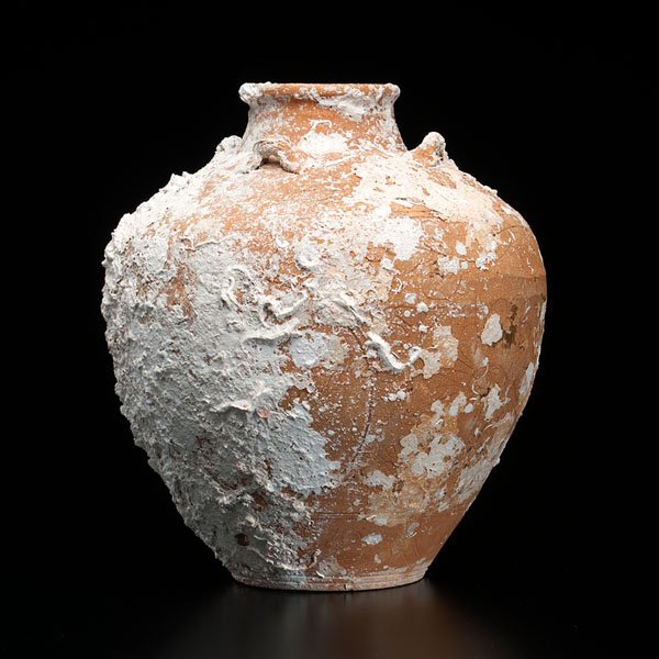 Large Terra Cotta Jar : Large Terra Cotta Jar Vietnamese, 15th century. Excavated terra cotta jar with four small handles and a short neck, decorated with carved motifs. The jar is covered in plaster residues from the exc