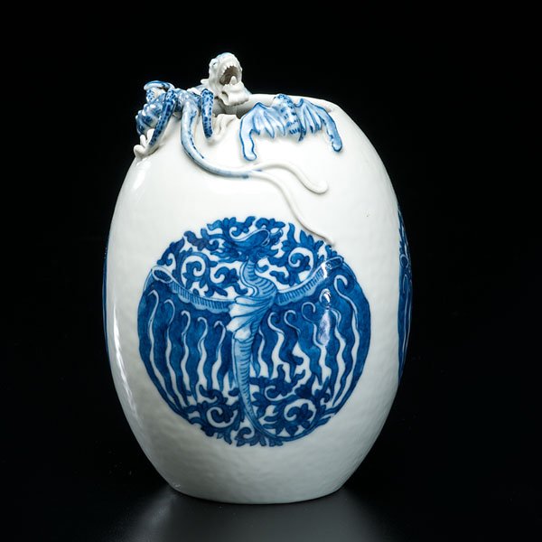 Chinese Egg-Shaped Vase with Dragon and Bat Relief : Chinese Egg-Shaped Vase with Dragon and Bat Relief Chinese, Qing Dynasty, ca 1650. This blue and white egg-shaped vase is adorned with a three-clawed dragon and bat relief, towards the opening at th