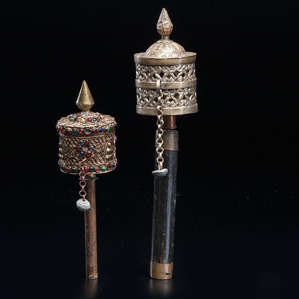 Pair of Tibetan Prayer Wheels : Pair of Tibetan Prayer Wheels Tibetan, 19th century. Two Buddhist prayer wheels. Both wheels are made of gilded brass; one wheel shows a polychrome grass inlay. Ht. 12.75 in. Provenance: Property