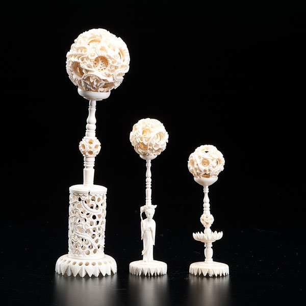 Three Carved Reticulated Ivory Balls with Pedestals