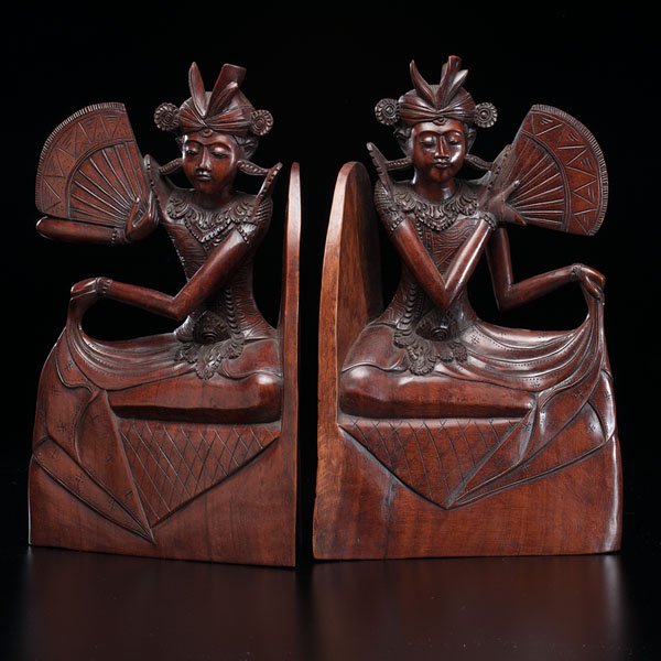 Wood Bookends Representing Female Dancers : Wood Bookends Representing Female Dancers Indonesian, Late 19th century. Two bookends made out of carved polished wood, and representing two female dancers with fans. 8 x 13 in. Provenance: Proper