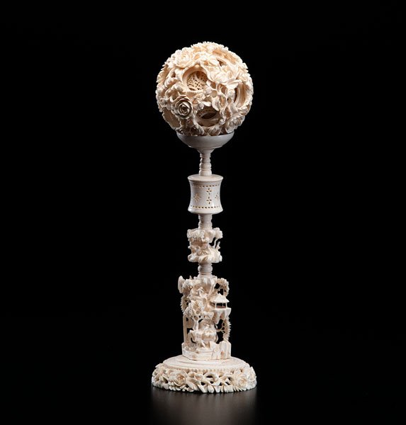 A Chinese Ivory Puzzle Ball on Stand : A Chinese Ivory Puzzle Ball on Stand Southern Chinese, late 19th century. A seven-layer carved ivory puzzle ball with fine floral exterior, atop carved stand with mountainous sections. Overall ht. 1
