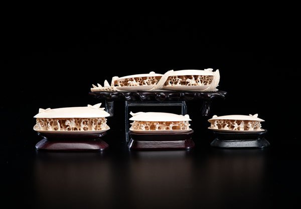 Group of Chinese Carved Ivory Shells : Group of Chinese Carved Ivory Shells Early 20th century. A group of four ivory carvings of shells, including one bridge with two shells, and three single shells. Each shell contains a carved scene
