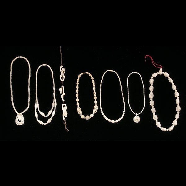 A Collection of Chinese Carved Ivory Jewelry : A Collection of Chinese Carved Ivory Jewelry 19th century. A group of six carved ivory necklaces, and one carved ivory pendant, showing three monkeys performing the "see, hear, and speak no evil" 