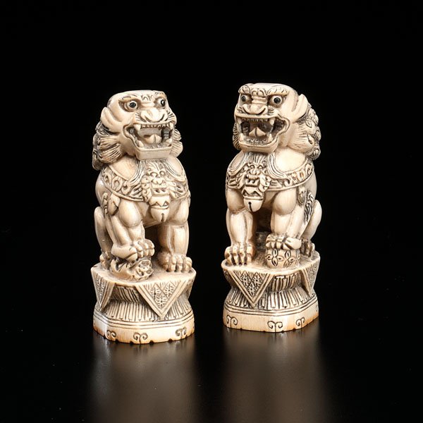 Chinese Ivory Foo Dogs : Chinese Ivory Foo Dogs Chinese, early 20th century. A pair of Foo Dog guardians, each posed on altar stands in ivory. Four-character mark to underside; ht. 5.5 in.