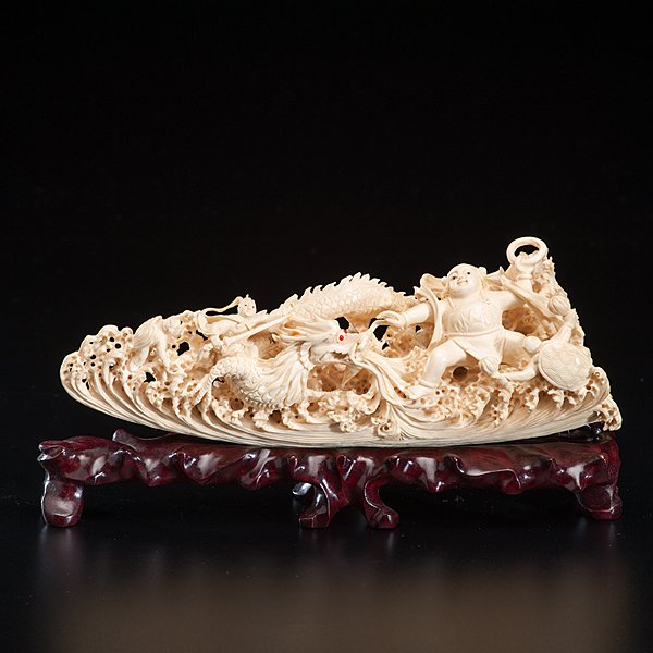 Chinese Carved Ivory Warriors and Dragon : Chinese Carved Ivory Warriors and Dragon Chinese, early 20th century. A carved ivory figural group, having dragon and warriors, from a single tusk, in box. Lg. 9.75 in.