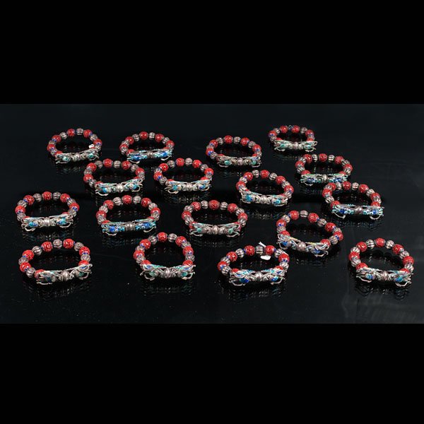 Collection of Chinese Cinnabar Bracelets : Collection of Chinese Cinnabar Bracelets Chinese. A collection of seventeen cinnabar beaded and silver enameled dragon bracelets. Dia. 4 in. (each).