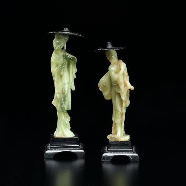 Japanese Carved Hard Stone Figures : Japanese Carved Hard Stone Figures Japanese, 20th century. A pair of carved hard stone figures of a man and a woman holding wooden parasol umbrellas. Each on a carved wooden stand. Ht. 9.5 in. (tall